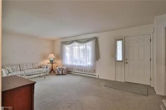 unfurnished living room featuring a baseboard radiator and carpet flooring