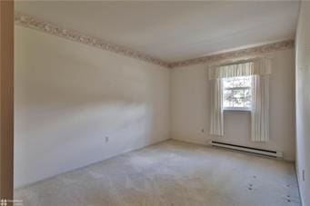 empty room with a baseboard radiator