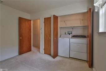 washroom with laundry area and washing machine and dryer