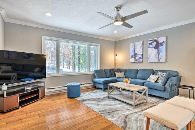 living room featuring a ceiling fan, crown molding, wood finished floors, and a textured ceiling