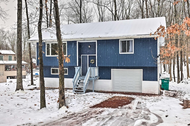 bi-level home featuring a garage