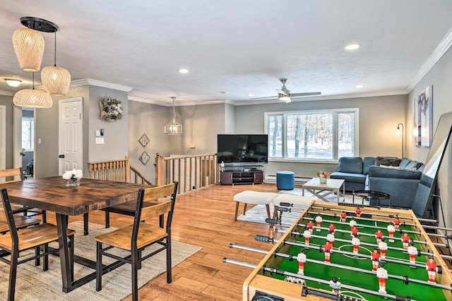 rec room featuring recessed lighting, crown molding, ceiling fan, and hardwood / wood-style flooring