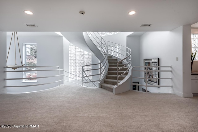 staircase with baseboards, carpet flooring, visible vents, and recessed lighting