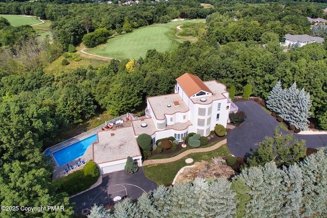 drone / aerial view with a view of trees