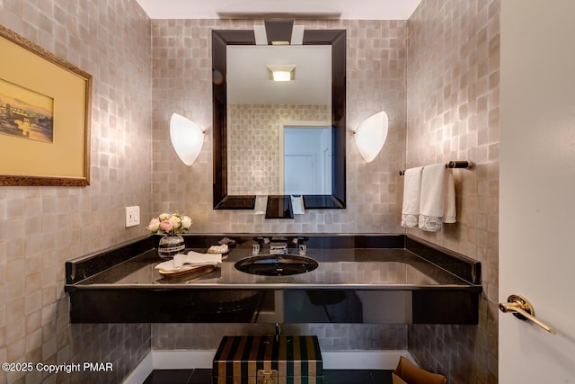 bathroom featuring tile walls and vanity