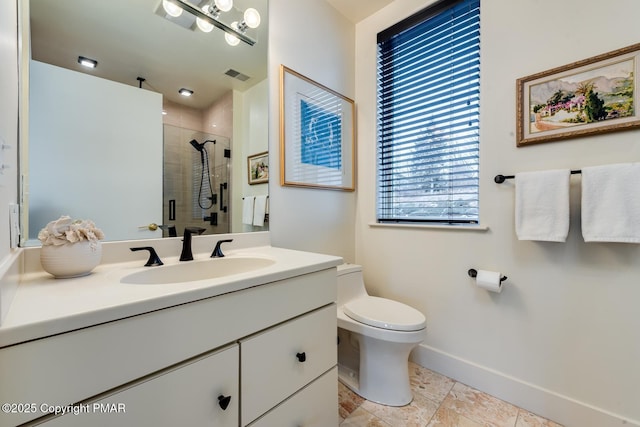 bathroom featuring toilet, vanity, visible vents, baseboards, and a shower stall