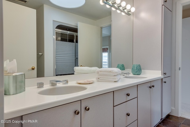 full bath with double vanity and a sink