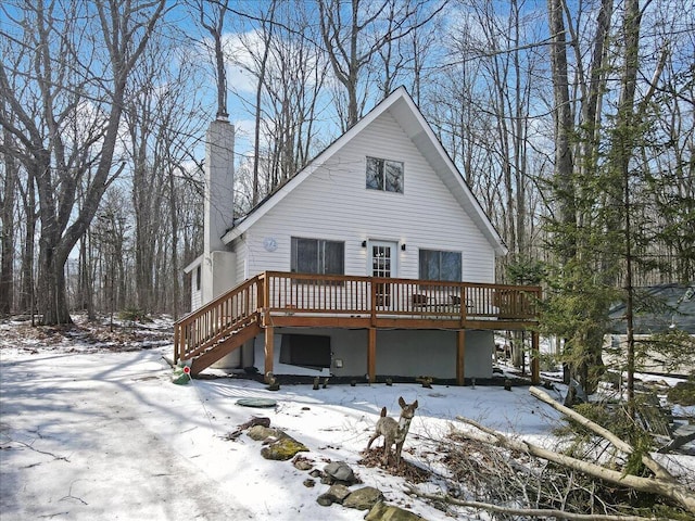 view of front of property featuring a chimney and a deck