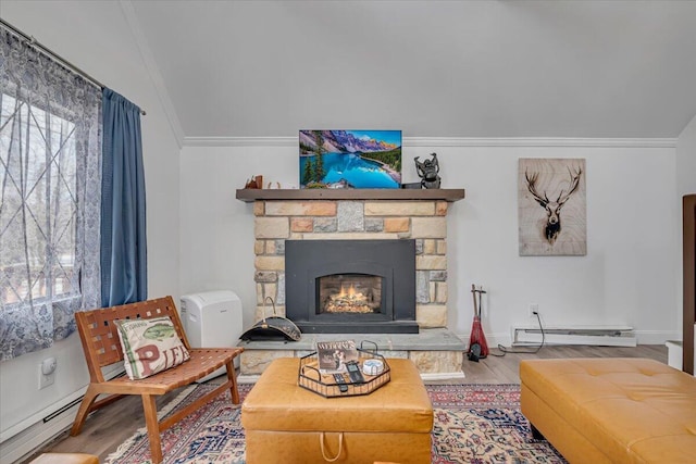 living room featuring wood finished floors, a fireplace, ornamental molding, a baseboard heating unit, and baseboard heating