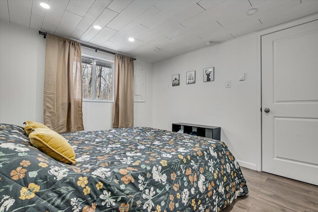 bedroom featuring wood finished floors