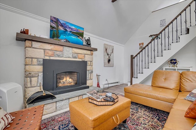 living room with a baseboard heating unit, wood finished floors, a fireplace, lofted ceiling, and stairs