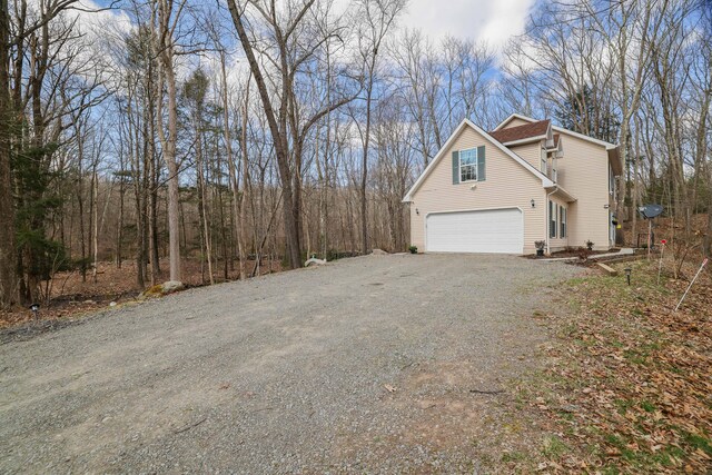 106 Alwen Ave, East Stroudsburg, PA 18301 - view of side of home featuring gravel driveway and a garage