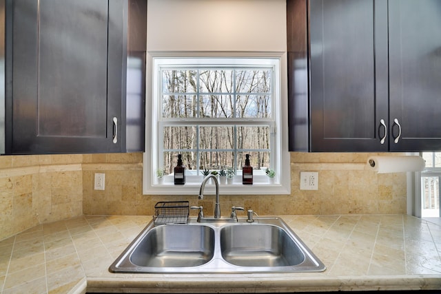 106 Alwen Ave, East Stroudsburg, PA 18301 - kitchen featuring a sink, tile counters, and backsplash