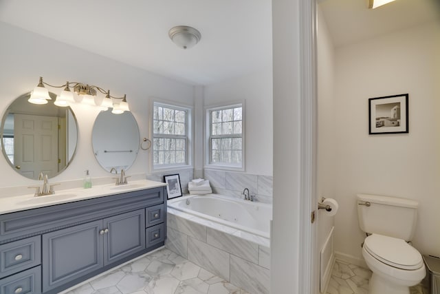 106 Alwen Ave, East Stroudsburg, PA 18301 - full bathroom with marble finish flooring, double vanity, a jetted tub, and toilet