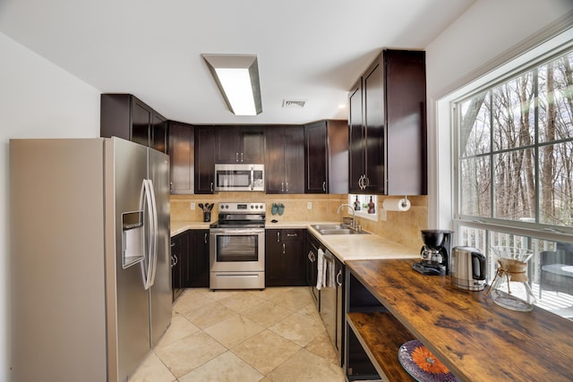 106 Alwen Ave, East Stroudsburg, PA 18301 - kitchen featuring appliances with stainless steel finishes, a sink, healthy amount of natural light, and decorative backsplash