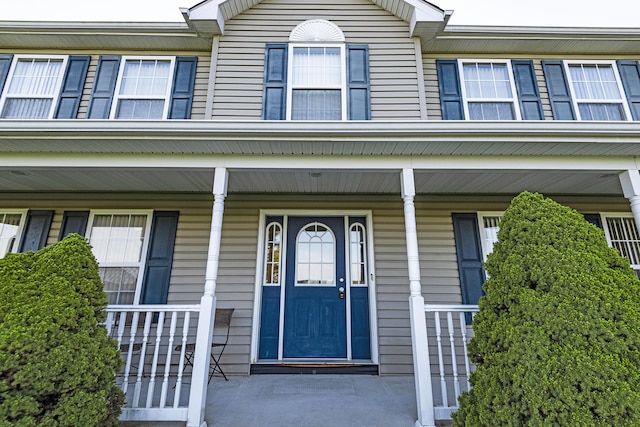 property entrance featuring covered porch