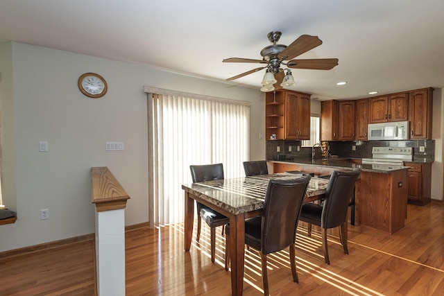 dining area with recessed lighting, ceiling fan, baseboards, and light wood-type flooring