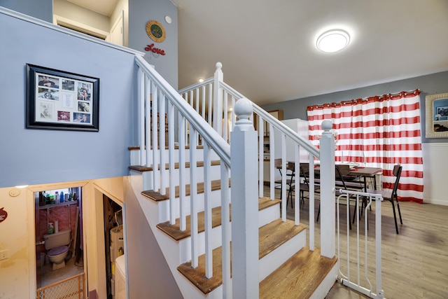 stairs with wood finished floors