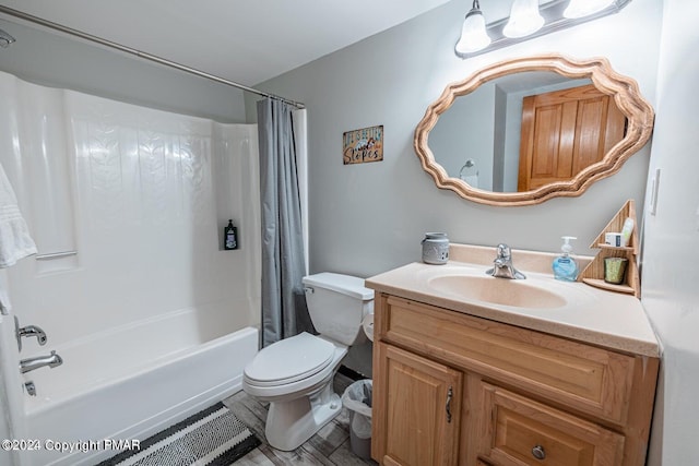 bathroom with shower / bath combo, vanity, and toilet