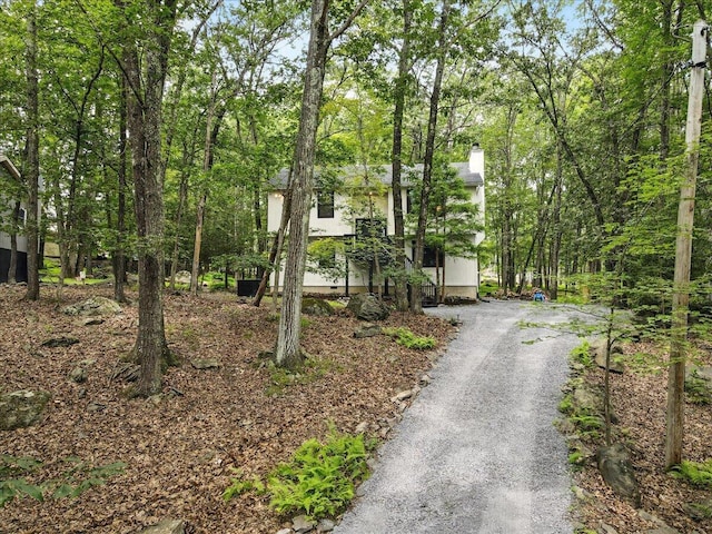 754 Clubhouse Dr, East Stroudsburg, PA 18302 - view of front of home with a chimney and dirt driveway