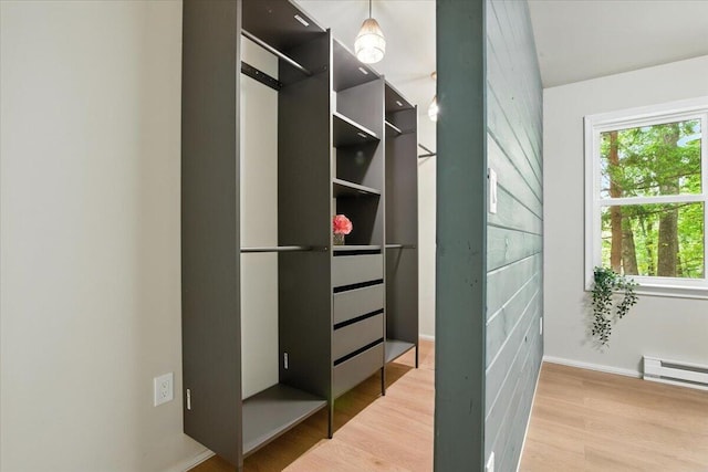 754 Clubhouse Dr, East Stroudsburg, PA 18302 - walk in closet with wood finished floors and baseboard heating