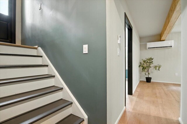 754 Clubhouse Dr, East Stroudsburg, PA 18302 - staircase featuring a wall mounted AC and wood finished floors