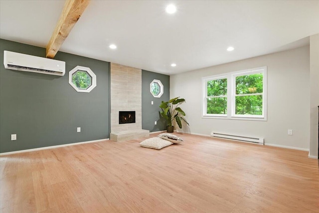 754 Clubhouse Dr, East Stroudsburg, PA 18302 - workout area with a baseboard radiator, a wall mounted AC, recessed lighting, a fireplace, and wood finished floors