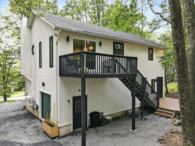 754 Clubhouse Dr, East Stroudsburg, PA 18302 - rear view of house with a shingled roof and a deck