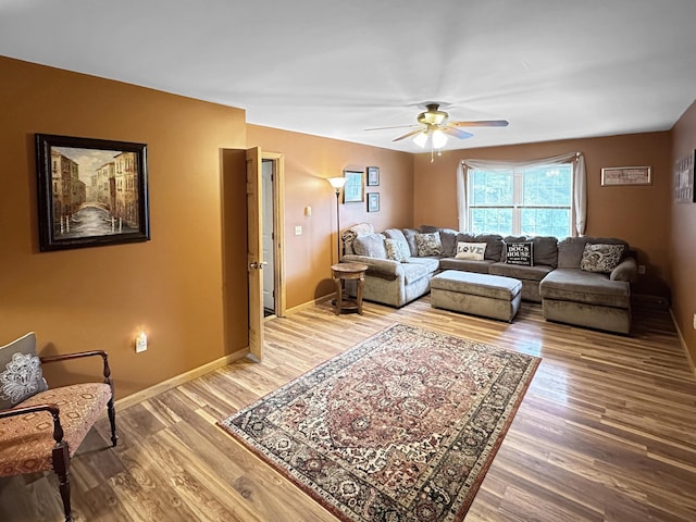 228 Wilbur Bloom Blvd, East Stroudsburg, PA 18302 - living area with baseboards, a ceiling fan, and light wood-style floors