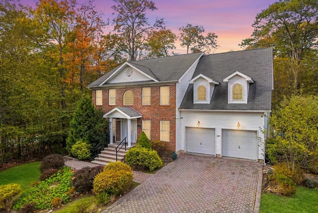 258 Dorset Rd, Tobyhanna, PA 18466 - view of front of property with decorative driveway, an attached garage, and roof with shingles