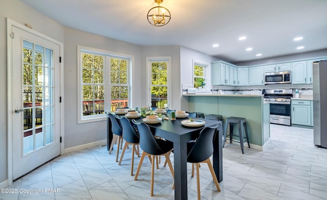 258 Dorset Rd, Tobyhanna, PA 18466 - dining space featuring light marble finish flooring, recessed lighting, baseboards, and a chandelier