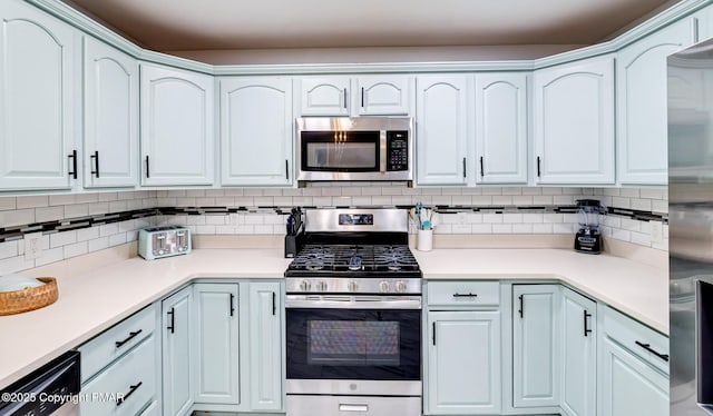 258 Dorset Rd, Tobyhanna, PA 18466 - kitchen with appliances with stainless steel finishes, backsplash, and light countertops