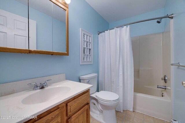 full bathroom with vanity, toilet, tile patterned flooring, and shower / bath combo