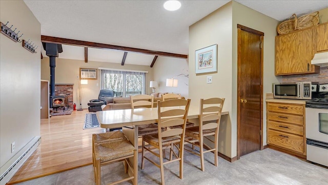 dining area featuring lofted ceiling with beams, light wood-style flooring, a wood stove, baseboard heating, and an AC wall unit