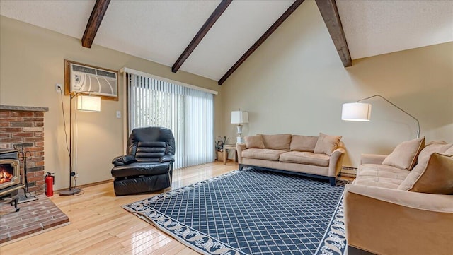 living area featuring a textured ceiling, a wall unit AC, a baseboard heating unit, beam ceiling, and wood-type flooring