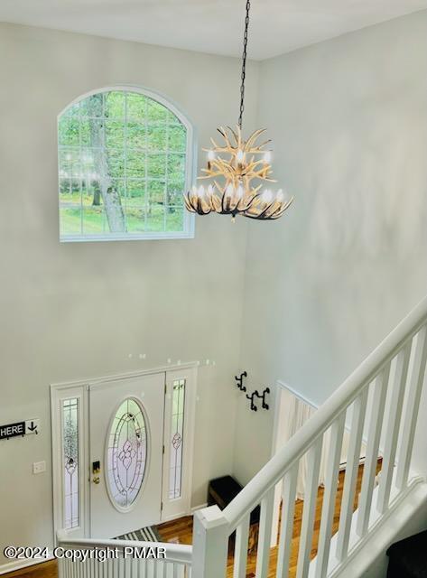 entrance foyer with a high ceiling and stairway