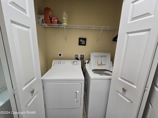 laundry area with laundry area and separate washer and dryer