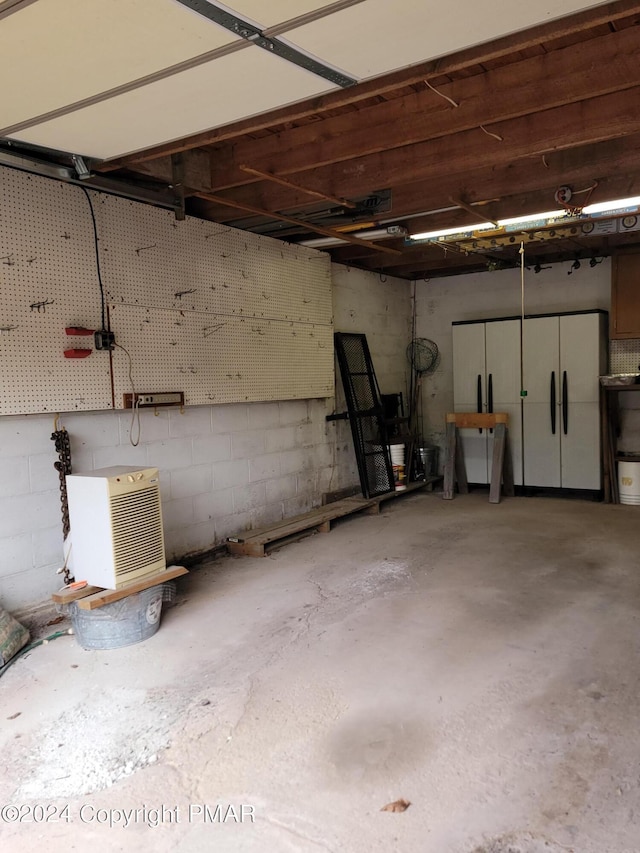 garage with concrete block wall