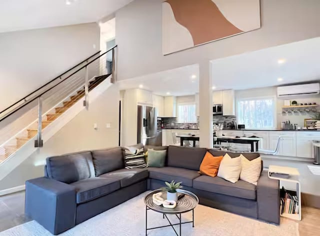 7126 Robinwood Dr, Tobyhanna, PA 18466 - living area with recessed lighting, stairs, a wall mounted AC, and wood finished floors