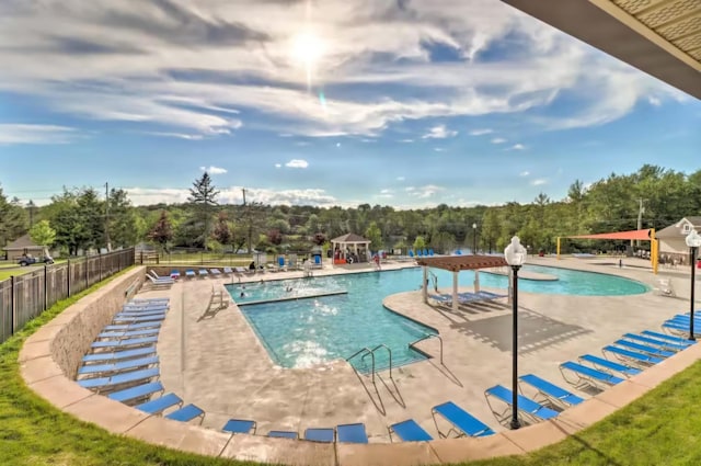 7126 Robinwood Dr, Tobyhanna, PA 18466 - community pool featuring a patio area and fence