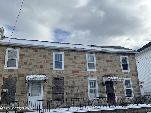 view of property with stone siding