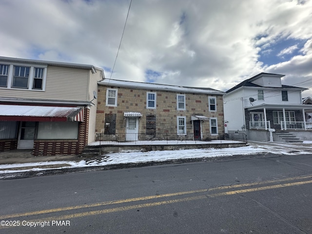 multi unit property featuring stone siding