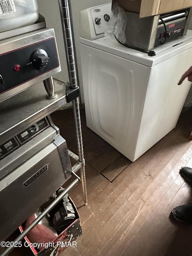 laundry room featuring wood-type flooring