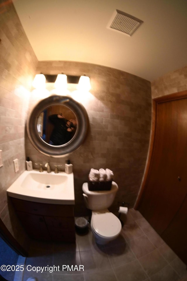 101 Withywindle Way, Tamiment, PA 18371 - bathroom featuring vanity, tile walls, and tile patterned flooring