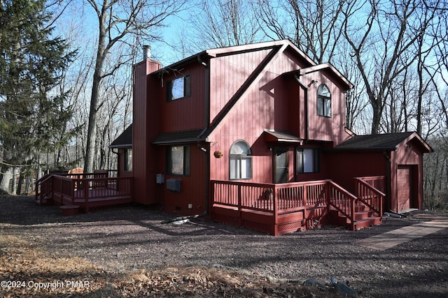 101 Withywindle Way, Tamiment, PA 18371 - rear view of house featuring a wooden deck and a chimney