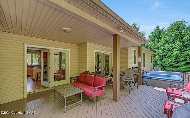 deck with a hot tub