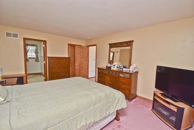carpeted bedroom featuring baseboards and visible vents