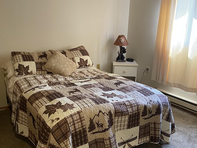 carpeted bedroom with baseboard heating