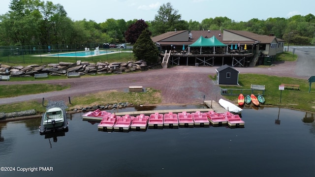 birds eye view of property with a water view