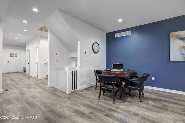 dining room with baseboards, visible vents, wood finished floors, and recessed lighting